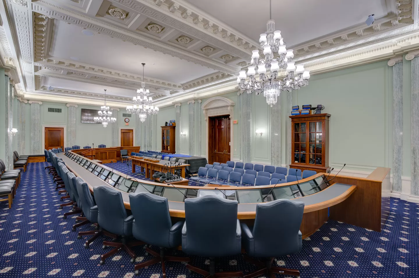 The finished SR-253 hearing room, with the ceiling and plaster reliefs repainted to appear like carved stone, which is truer to the architects' original intention.